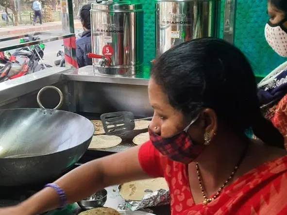 Sewan cook preparing food at a kitchen counter