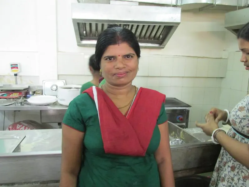 Smiling Sewan kitchen staff member